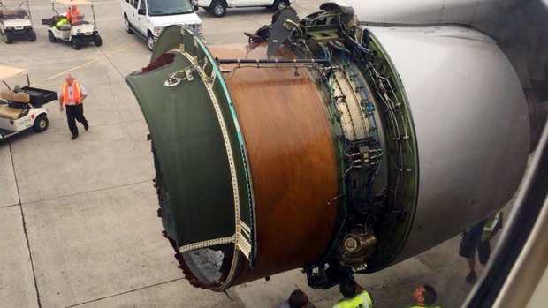 This photo provided by passenger Haley Ebert shows damage to an engine of a Boeing 777 after parts came off the jetliner during its flight from San Francisco to Honolulu on Tuesday.