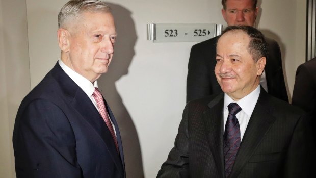 US Defence Secretary Jim Mattis shakes hands with Iraqi Kurdish leader Masoud Barzani in Munich on Friday.