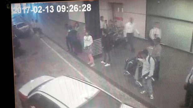 CCTV from Kuala Lumpur airport shows one of the women, centre in white, arrested in connection with Kim Jong-nam's death.