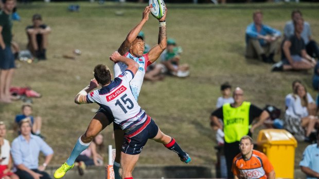 Bomb specialist: Folau flies high to take an AFL-style catch. 