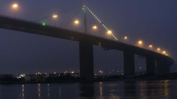 Evening fog closes in on the West Gate Bridge, Melbourne.