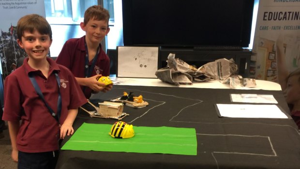 Max and James, both 8, put a small robot through its paces at the AISNSW DigiSTEM conference.