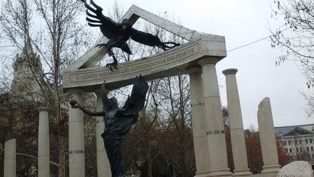 A monument erected by the Orban government with the German eagle swooping down on innocent Hungary.