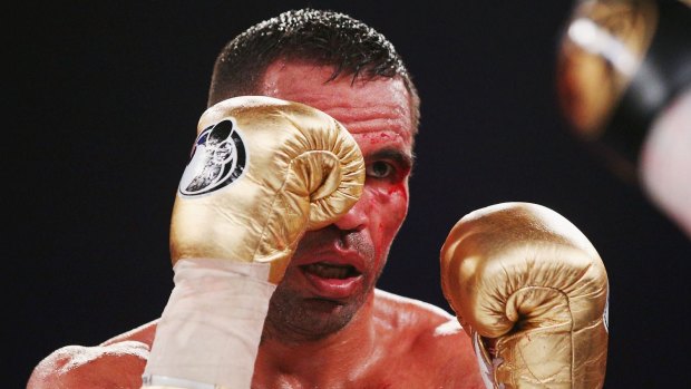 Welfare concerns: A bloodied Anthony Mundine during his last outing, a bad loss to Charles Hatley in November 2015.