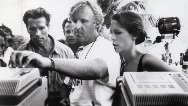 James Cameron pictured on the set of True Lies with Arnold Schwarzenegger and Jamie Lee Curtis.