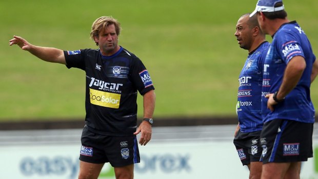 Feeling the strain: Coach Des Hasler instructs his team during a Canterbury Bulldogs training session at Belmore.