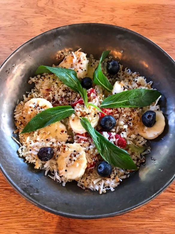 Banana, berries and quinoa salad with kiwi, lime and toasted coconut. 