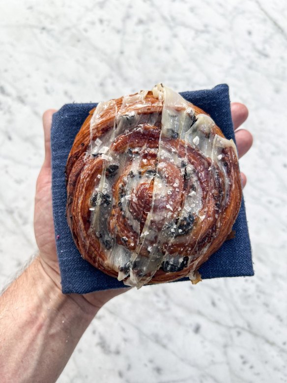 Loulou envelops escargots in a buttery, snail pastry.