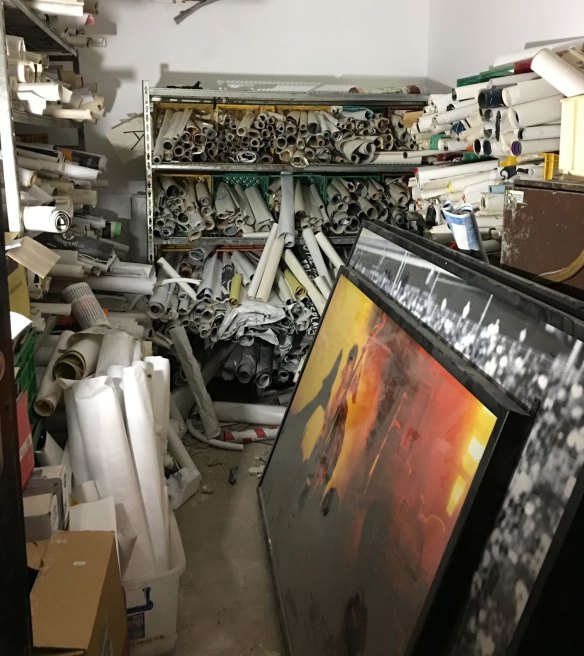 Some of the estimated 50,000 rock posters discovered on site during renovations.