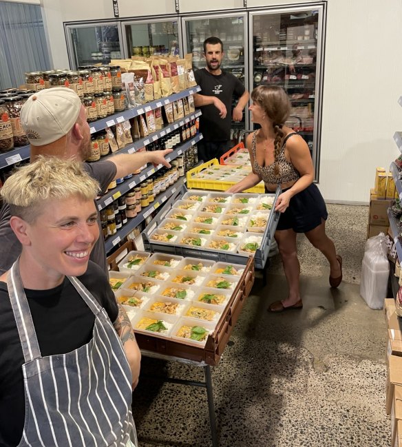 Some of the volunteers cooking and preparing meals.