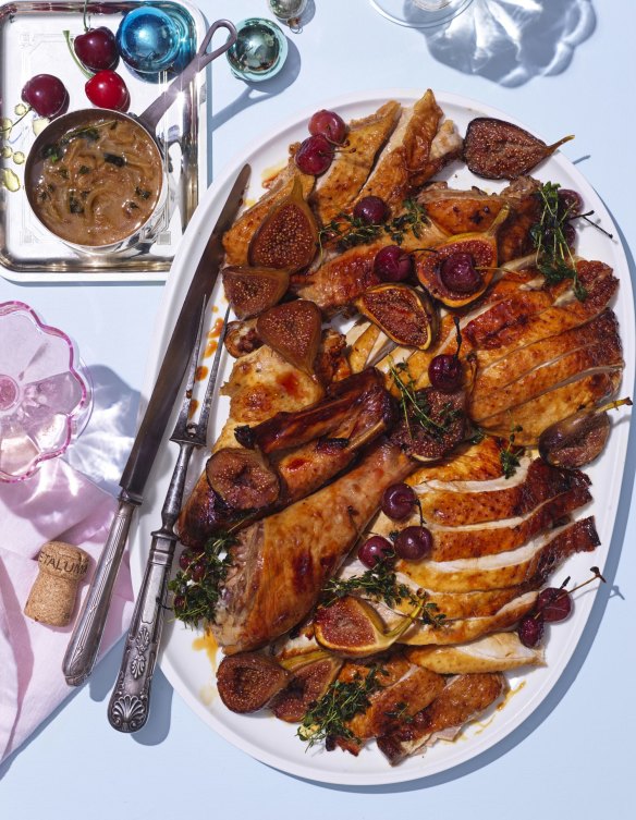 The carved turkey served with summer fruits such as cherries and figs (optional).