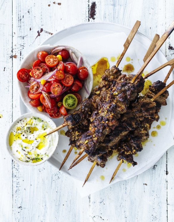 Spicy lamb skewers with cucumber yoghurt and cherry tomatoes.