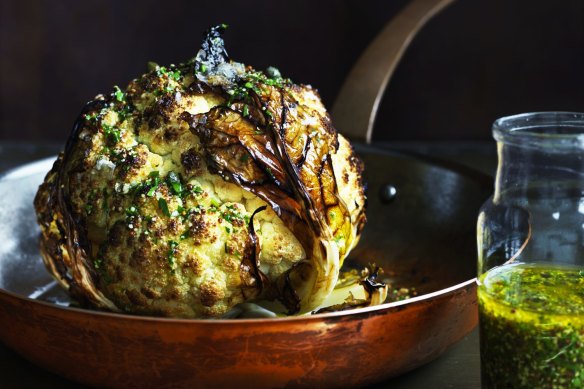 The trick to successfully roasting a whole cauliflower is to increase the humidity.