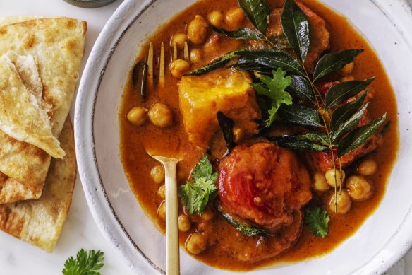 Serve this tomato and chickpea curry with flaky roti bread (or croissants!).
