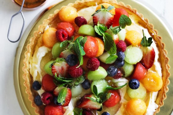 Melon and berry mascarpone tart with marmalade glaze.