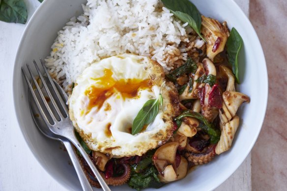 Thai-style stir-fry pad kra pao topped with a crispy fried egg.