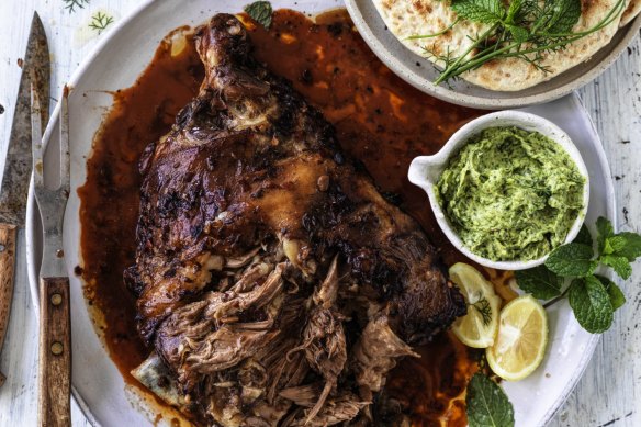 Whole roast lamb shoulder with Sichuan sauce, coriander and mint paste and sesame flatbread.