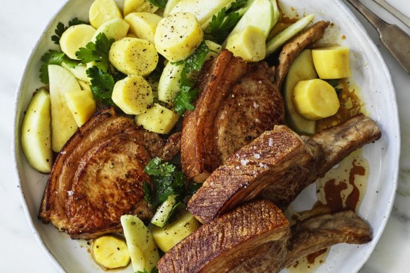 Pork chops with apple and potato salad.