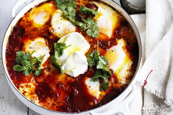 Baked eggs with spicy sausage and labna.