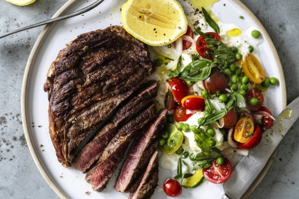 Seared scotch fillet with mozzarella, peas and cherry tomatoes.