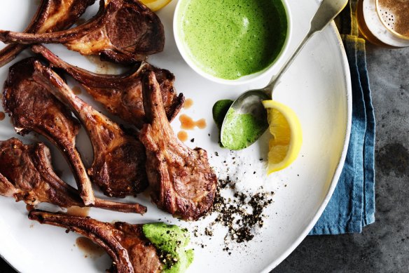 Lamb cutlets with green yoghurt sauce.