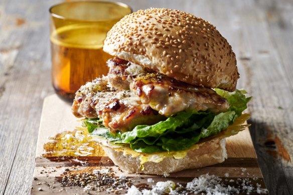 Chicken caesar burger sandwiched by a crispy, lacy, cheesy lid.