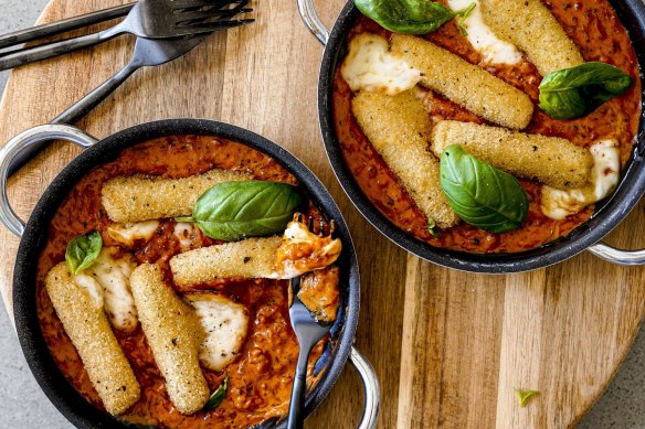 Mozzarella sticks swimming in creamy vodka and tomato sauce.