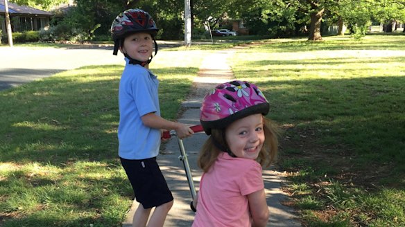 Aidan and Maeve Moloney enjoying the daily routine of getting to school on foot or two wheels.
