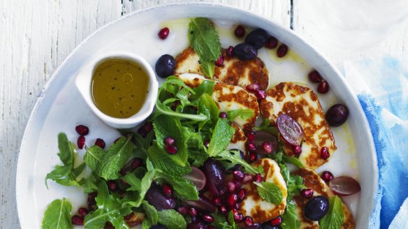 Warm salad of haloumi, grapes, olives and pomegranate with lemon vinaigrette. 