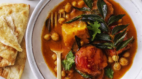Serve this tomato and chickpea curry with flaky roti bread (or croissants!).