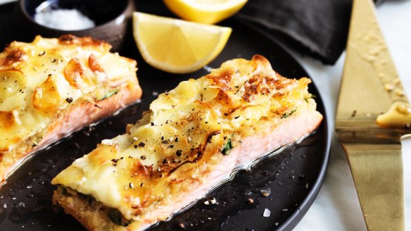 Herb-crusted ocean trout with potato gratin.