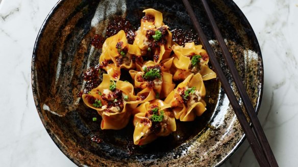 Serve the steamed dumplings with chilli oil and chopped chives.