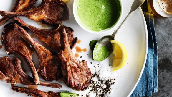 Lamb cutlets with green yoghurt sauce.