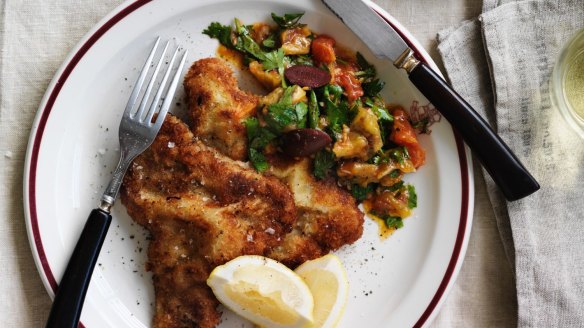 Veal schnitzel with eggplant and tomato salad.