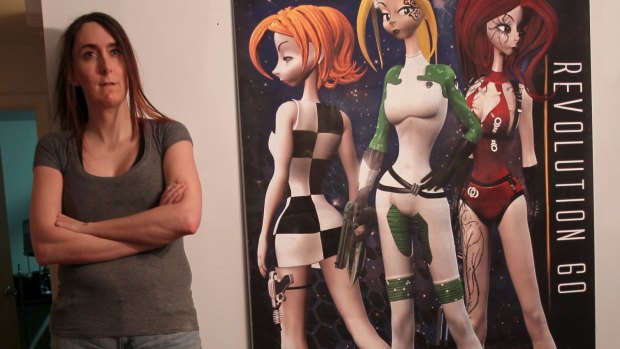 Game developer Brianna Wu with art from <i>Revolution 60</i>, the debut game from the studio she co-founded.