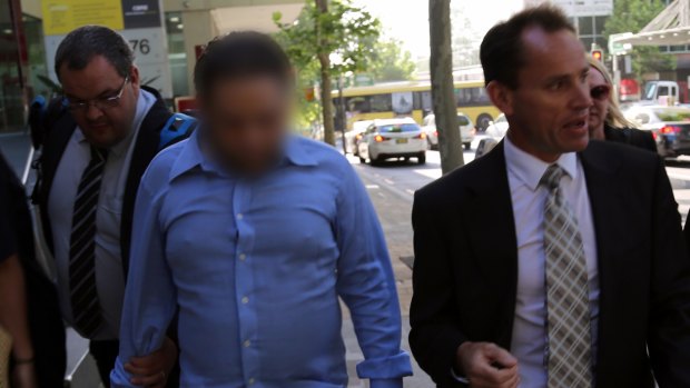 Ian Lazar is arrested in North Sydney on Thursday by detectives from Strike Force McMaster.