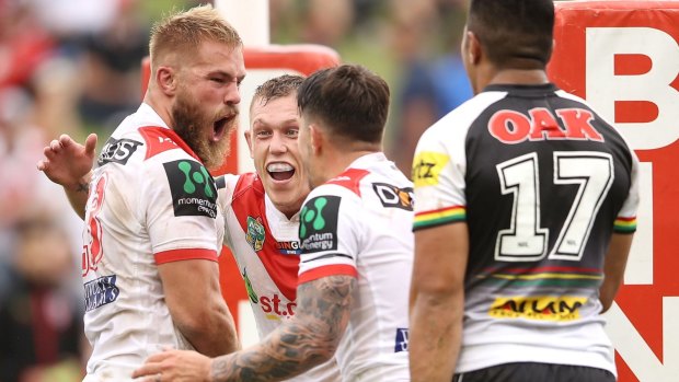 Workhorse: Jack De Belin celebrates his try in round one. 