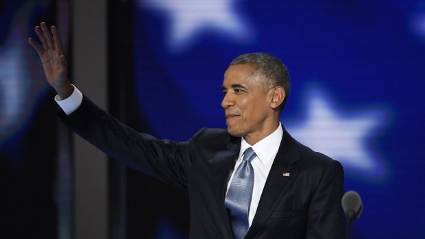 U.S. President Barack Obama waves while arriving on stage during the Democratic National Convention.