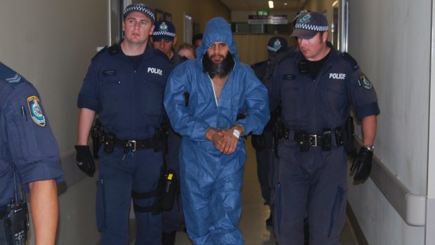 Malcolm Naden escorted from Manning Base Hospital in Taree in March 2012. 