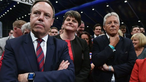 DUP Deputy Leader and North Belfast candidate Nigel Dodds, DUP Leader Arlene Foster and former DUP leader and Northern Ireland First Minister Peter Robinson watch the Belfast count on Thursday night.