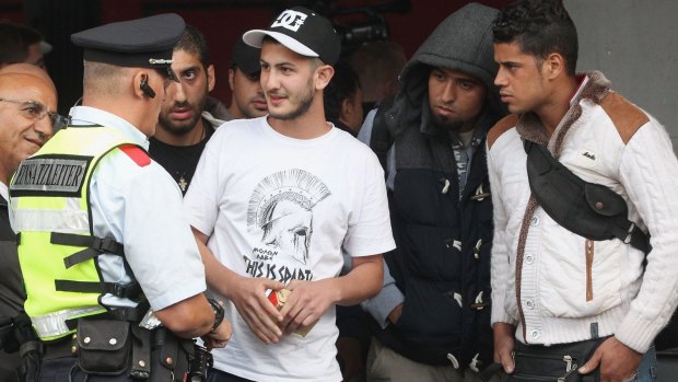 Migrants arrive from Austria at Munich Hauptbahnhof main railway station in Munich, Germany.