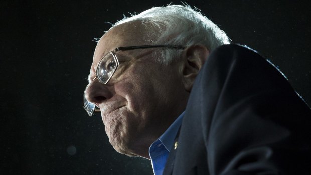 Presidential candidate Senator Bernie Sanders grimaces as he delivers his stump speech during a campaign stop at the University of New Hampshire.