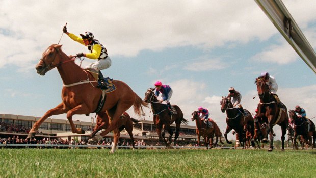 Famous pair: Darren Beadman rides Saintly to victory in the 1996 Melbourne Cup.