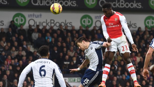 Danny Welbeck heads home the winner for Arsenal over West Brom.