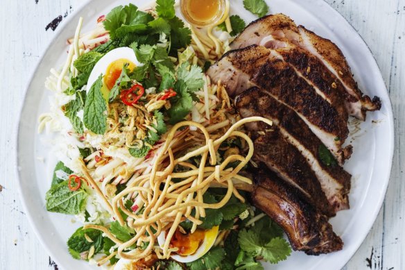 Spiced pork chops with boiled eggs, crispy noodles  and slaw.