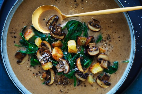 Lighten up: Brown mushroom and spinach soup with crunchy croutons.