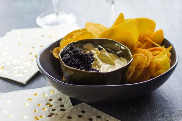 Kettle chips with champagne creme fraiche and caviar.