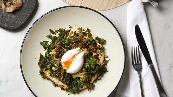 Kale and cauliflower salad, miso, almond, hummus, avocado, poached egg and puffed rice at Higher Ground.