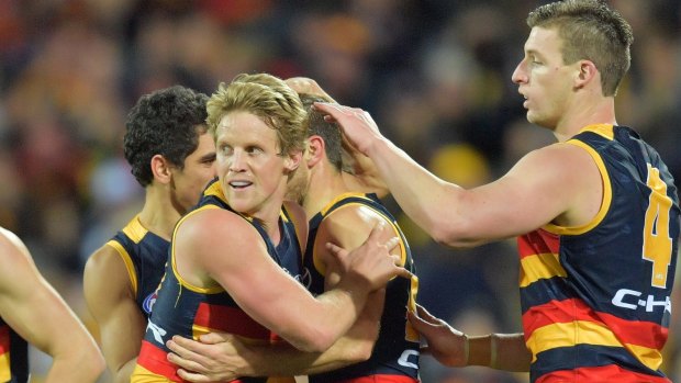 The Crows celebrate a goal in their match with Geelong, which saw them pull clear at the top of the ladder.
