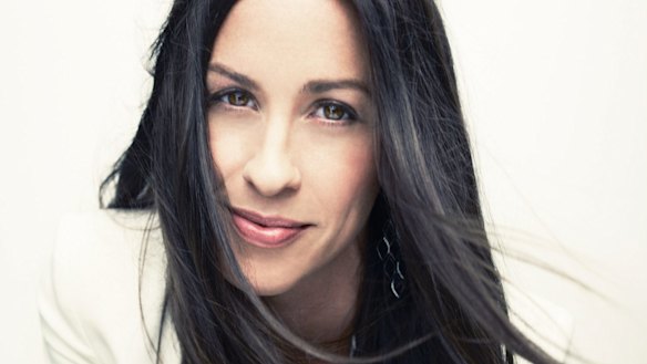 Morissette still sports her trademark long locks and centre part.